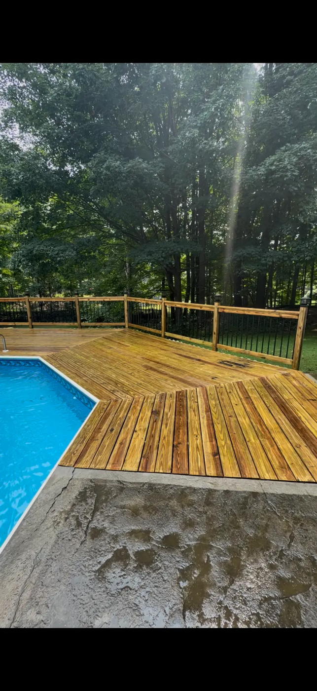 Weathered wood pool deck washed, sanded and sealed — after