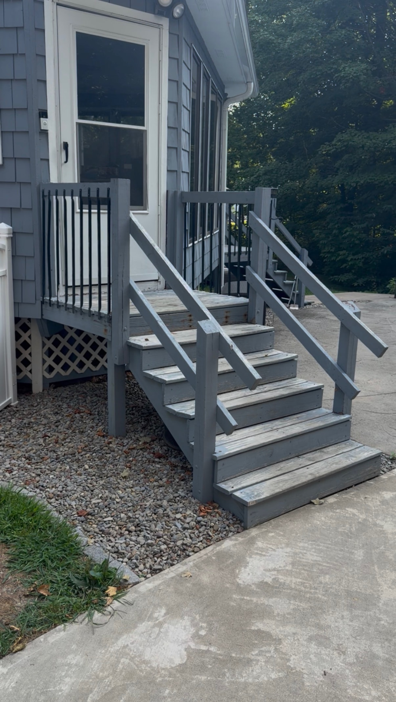 Worn porch steps and railings cleaned and repainted — before