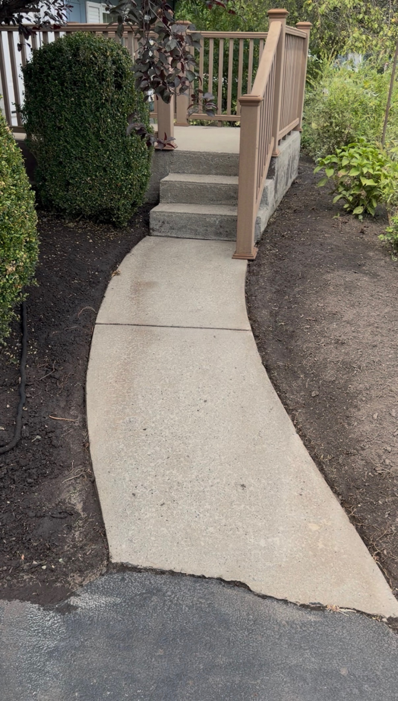 Overgrown front walkway cleared and edged — after