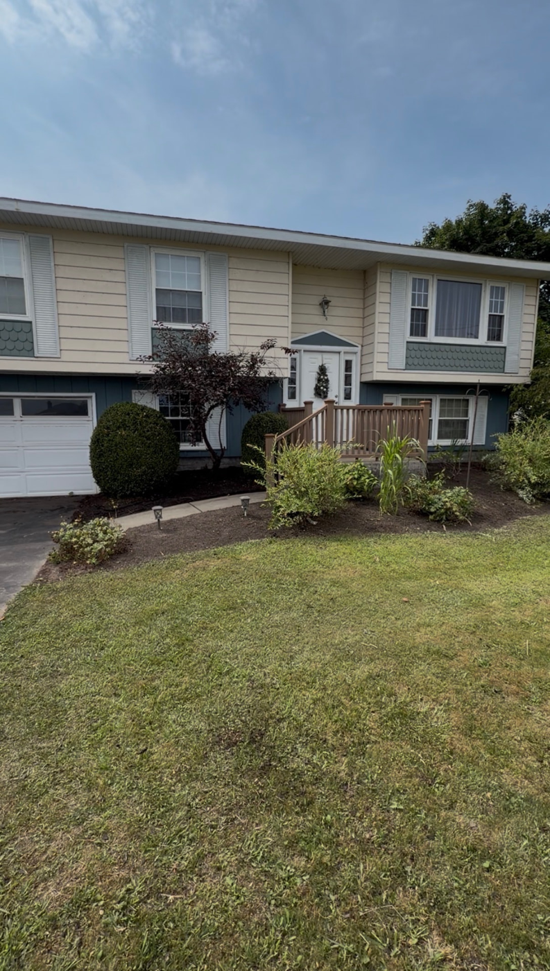 Front yard landscaping bed cleanup in Central New York — after
